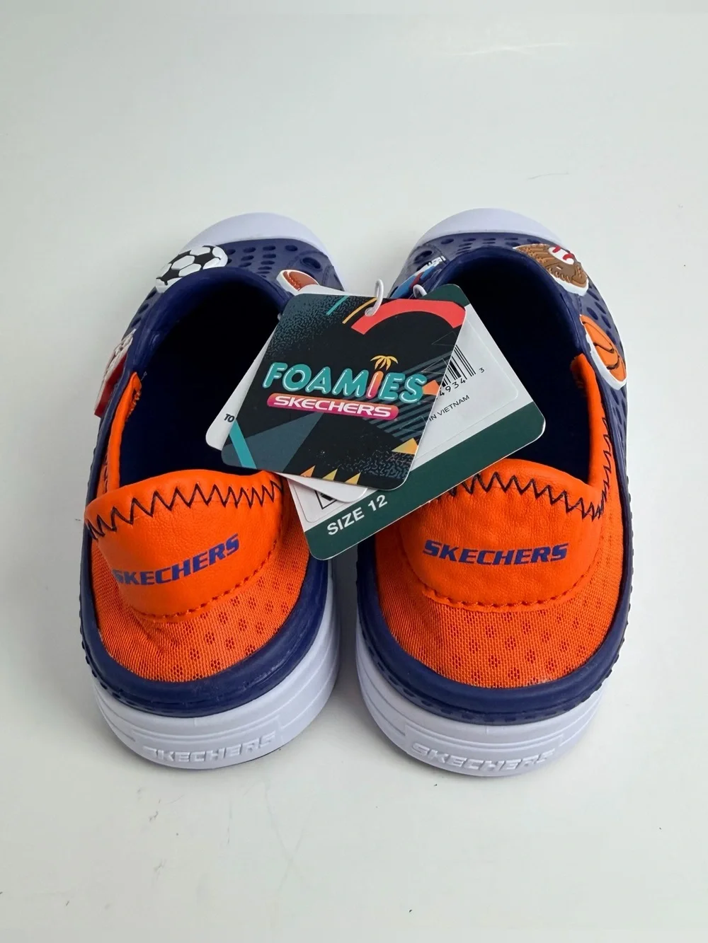 Skechers Navy Blue Kids Slip-On Sport Sandals with White Toe and Orange Lining